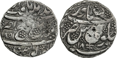 Peshawar, VS1891, Rupee
Stephen Album Rare Coins | Auction 31
SIKH EMPIRE: AR rupee (9.23g), Peshawar, VS1891//1891, KM-98.1, Herrli-13.01.04, first type, without the border of dots around the pipal leaf, a few nicks, nice overall, VF, RR. The weight of this piece corresponds to the contemporary Afghan rupee of about 9.2-9.4 grams, the weight of the last Barakzay rupees of Peshawar, struck anonymously by Sultan Muhammad Tala'i AH1247-1249. It is likely that the border of dots added later in VS1891 (began about 15 April 1834, near the end of AH1249) represent a reduction of the Peshawar rupee weight to about 8.4-8.5 grams. In order to confirm this theory, the weight of more Peshawar VS1891 rupees without the border of dots is needed.
