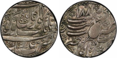 Kashmir Mint, VS1881, Akaal in Farsi
Stephen Album Rare Coins
Auction 41
SIKH EMPIRE: AR rupee (11.07g), Kashmir, VS1881, KM-46.7 var, Herrli-�, with the word AKAL sbove the word guru in the reverse center, unpublished and probably unique, PCGS graded XF45, RRR, ex Jess A. Yockers Collection. The word "akal" means "timeless" and is normal on the reverse of almost all silver and gold coins of Amritsar, usually together with "takht", meaning "the throne of the timeless one". The word above the word "guru" refers to the immortality of Gobind Singh. It is also found on the reverse of most silver of Kashmir, but never on the obverse, with the exception of this unique piece.
