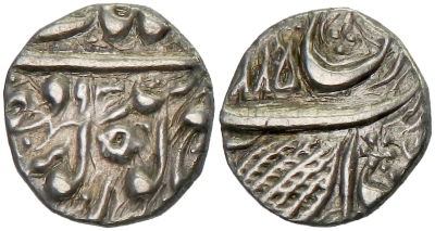 Amritsar, VS1885/1893, Nanakshahi 1/4 Rupee
http://db.stevealbum.com/php/lot_auc.php?site=2&sale=18&lot=1577&lang=1&cust=0
Steve Album Auction 18 - Lot 1577
SIKH EMPIRE: AR ¼ rupee (2.67g), Amritsar, VS[18]93, KM-18.3, Herrli-01.11.06, VS1885 atop reverse, somewhat cleaned, VF, R. 
Was the KM photo in previous editions, replaced in the latest edition by an example of Herrli-01.12.06.
