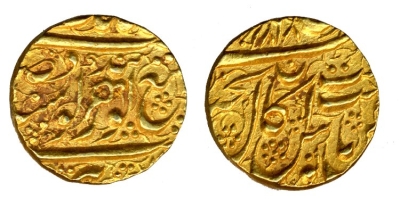 Amritsar, VS1868, Nanakshahi Gold Mohur
� The Trustees of the British Museum

http://www.britishmuseum.org/research/collection_online/collection_object_details.aspx?objectId=1493499&partId=1

The leaf symbol is absent on this coin, which carries the Akal Takht legend instead alongwith a letter 'nun'
