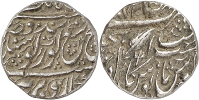 Jhang; VS1873 Rupee, Trident on the Rev.
The New York Sale, AUCTION XXX, 9 January 2013
Lot No. : 512
WORLD COINS. INDIA. Sikh Empire. temp. Ranjit Singh (VS 1858-1896 / 1801-1839 AD). Silver Rupee, dated VS 1873 (AD 1816), � Dar Jhang � mint. AR, 11.11g, 23mm. Obv. Herrli Nanakshahi couplet V. Rev. Mint and date formula, pipal leaf and star, VS date above, trident symbol below leaf; �Dar Jhang� in persian to left (Wiggins & Goron, type I; Herrli 01.09.04, p.58; KM 20.1a). Very fine, some deposits, small shroff mark on the obverse and banker�s marks on edge.

http://www.sixbid.com/browse.html?auction=579&category=13187&lot=599651
