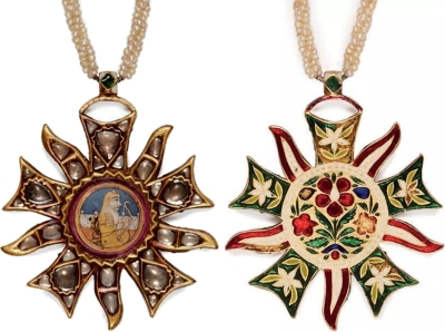 Kaukab-i-Iqbal-i-Punjab, 1st Class
Rosebury's Auctions, London, UK

An enamelled and diamond-set gold Order of Merit of Maharaja Ranjit Singh, the first Sikh maharaja of the Panjab (r.18011839), Lahore, circa 1830s, in the form of a gold star set with diamonds to each arm in the kundan technique,containing to centre a portrait in gouache heightened with gold on paper of Ranjit Singh seated and holding a bow by an artist of the court, enamelled to reverse with an alternating design of white flowers on green ground, and red and white petals and to centre roundel flower heads and leaves, on a later twisted rope of small pearls, merit 4.5cm. diam. x 5.5cm. high

Classes -
1st Class - Diamonds
2nd Class - Diamonds & Emeralds
3rd Class - Emeralds
