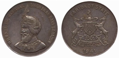 Faridkot, Medallic 5 Rupees, AD1941
Issued during the Viceregal visit to the state in 1941.
Baldwins Auctions Ltd. Auction 40 (03.05.2005) Faridkot, Silver Nazarana 5-Rupees, 57.8g, 1941, obv bust of H H Raja Sir Harinder Singh facing left, rev coat of arms and date 1941, 51mm. About extremely fine, some small surface stains and markings, gray patina, a superb coin, extremely rare .
This unreported specimen is undoubtedly from the series of Nazarana or Medallic Rupees and Fractional Mohurs struck in 1941. The reverse coat of arms and the style resembles that of the previous lot. The weight (57.8g) is a little short of the official 5-Rupee weight of 58g.
