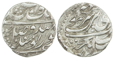 Amritsar, VS1843, Nanakshahi Rupee, NS318
Steve Album Auction 21, Lot #1298
SIKH EMPIRE: AR nanakshahi rupee (11.15g), Amritsar / Mehta? VS(18)43 year 318, KM-A20.3, Herrli-01.05.04, mismatched date (should be year 316 for VS1843), both dates boldly clear, unpublished, bold VF, RRR. The reverse of this piece is sufficiently off center to reveal the extra word above the mint name Amritsar, and it has been suggested that it reads mehta for the city by that name located about 20 miles away from Amritsar, a location of considerable importance for the Sikh Empire at the time this coin was struck.
http://db.stevealbum.com/php/lot_auc.php?site=2&sale=21&lot=1298&lang=1&cust=0

The additional word above has been read as Sobha/Suba on a few coins.
