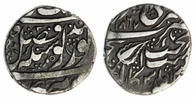Amritsar, VS1867, Nanakshahi Rupee
(Obv.) Fath within the 'laam' of 'fazl'
(Rev.) 'tani' abpve 'takht'

https://www.numisbids.com/n.php?p=lot&sid=5379&lot=323
