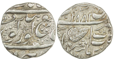 Amritsar, VS1882, Nanakshahi Rupee
Steve Album, Auction 21
Lot 1307
SIKH EMPIRE: AR nanakshahi rupee (10.86g), VS1881, KM-—, Herrli-—, generally in the style of Amritsar, but with an unread mint name in the upper panel of the reverse, bold strike, VF to EF, RRR, ex M.H. Mirza Collection. 
With cross-like symbols on obverse & reverse, unrecorded by Herrli. This is the first example of this type we have seen.
http://db.stevealbum.com/php/lot_auc.php?site=2&sale=21&lot=1307&lang=1&cust=0
