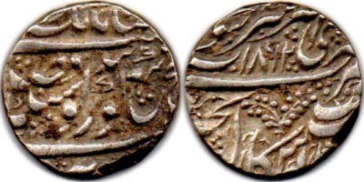 Amritsar, VS1862, Bershahi Rupee
These coins were rumored to be Moranshahi's and attributed to have been struck with reference to Moran, a dancer in Maharaja Ranjit Singh's court. But in reality it seems to be an experiment with the reverse symbol, and in all probability is a representation of the revered Ber trees in the Harmandir Sahib Complex, Sri Amritsar & shows the fruit laden sprigs.

