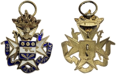 Kapurthala, Order of Pride, 3rd Class, Breast Badge
Jain Auction House, Kolkata
Auction 1

Kapurthala Medal.
Order of Pride Breast Badge,Third Class, ALMOST UNCIRCULATED.
Barac-273.Dimensions:33mm x 45mm;Weight:16.01grms.Central coat -of -arms,with
white enameled horizontal band between two blue enameled bands;gilt, pinwheels, cannon and thistle from top to bottom; all set upon white enameled Maltese cross with gilt outline; blue enameled banner around bottom with gilt script “ PRO REGE ET PATRIA”; gilt silver helmet and crown above. Circular loop.the remainder of this RARE piece remains quite attractive, with great enameling overall.
